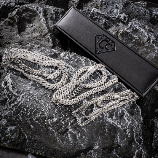 Silver Cuban link chain with diamond-like pavé detail, shown with gift box