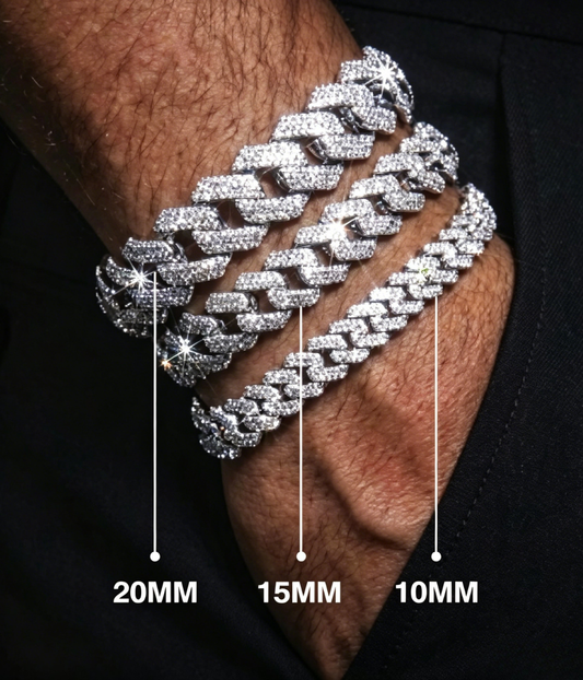 Silver-tone Cuban link bracelet with sparkling stones on wrist