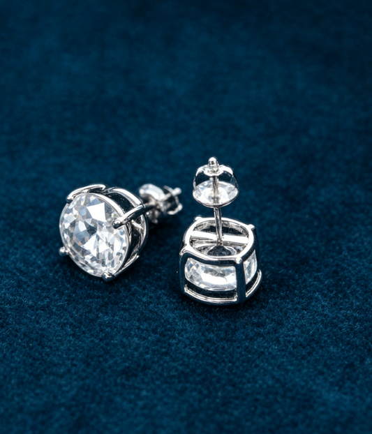 Round moissanite stud earrings, silver-tone settings with four-prong stones
