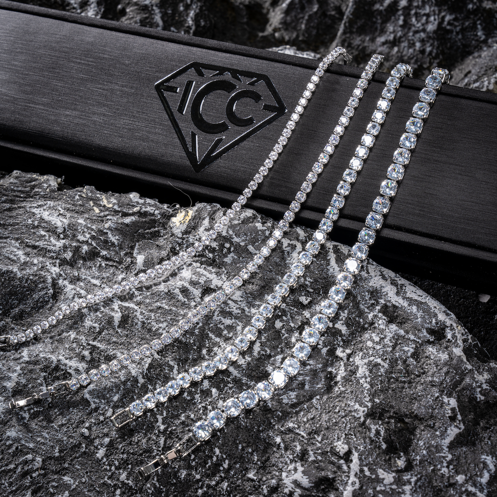 Silver moissanite tennis chain bracelet with rectangular stone links, multi-row.