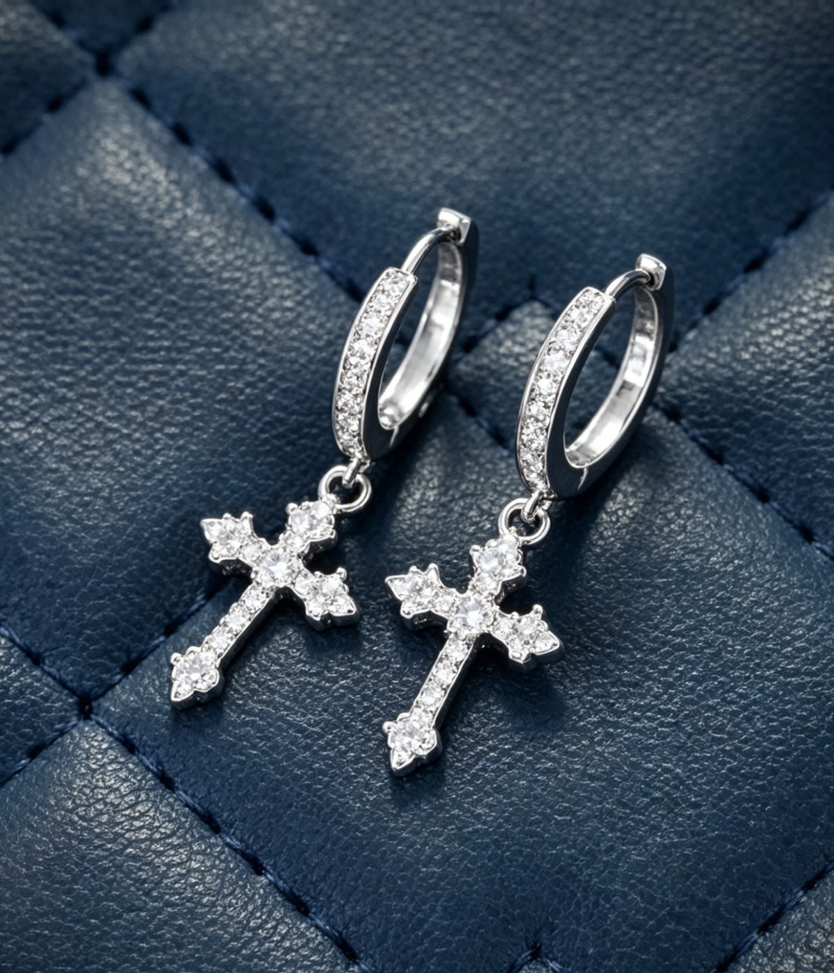 Crystal hoop earrings with dangling iced cross charms