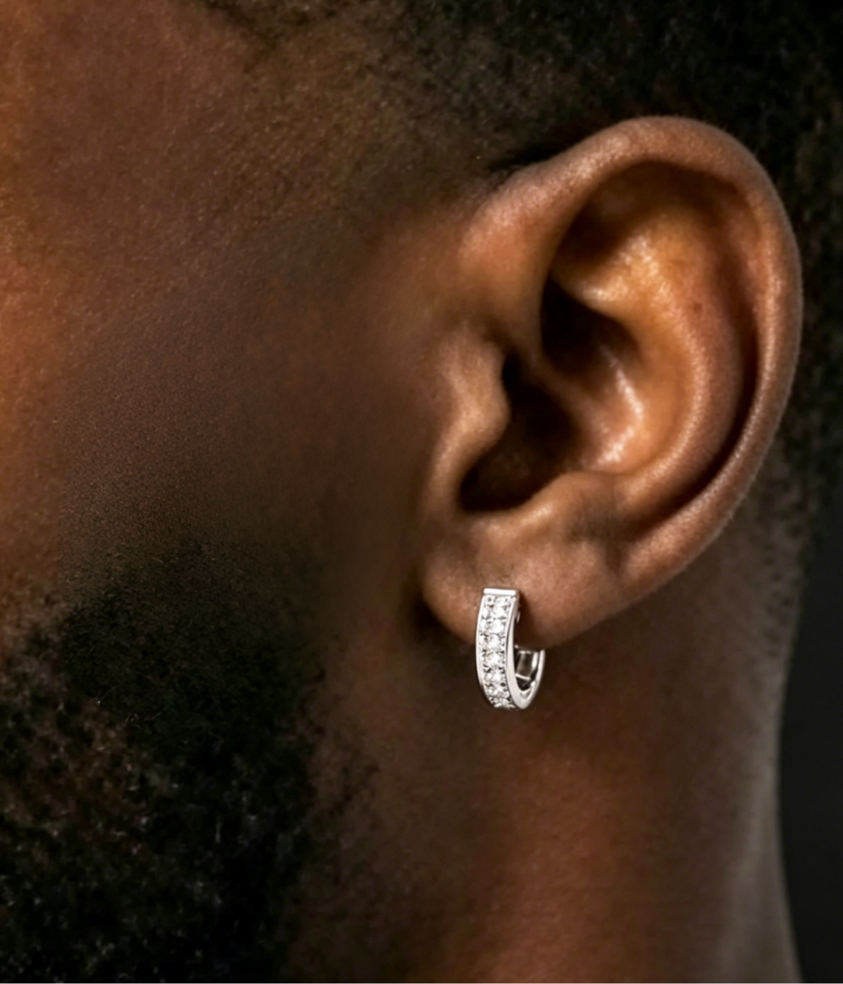 Side halo moissanite hoop earrings with pavé stones, silver-tone, worn on ear