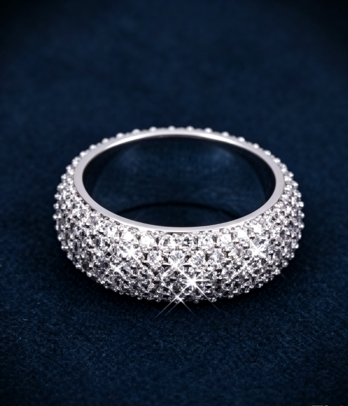 Five-row iced band ring with diamond-like sparkle, round silver-tone band.
